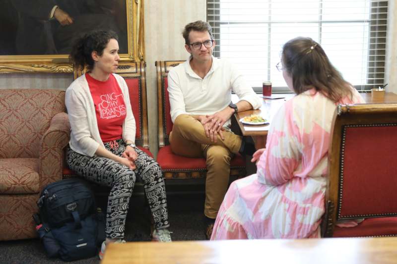 a group of people sitting in chairs
