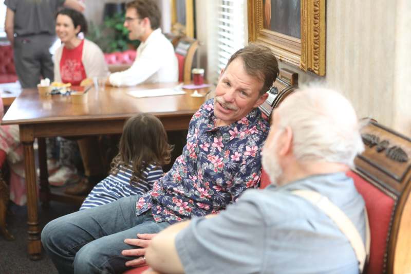 a group of people sitting at a table