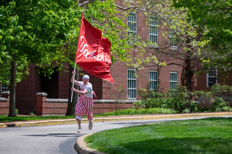 a man running with a flag
