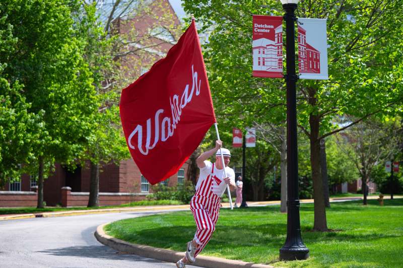 a man in roller skates holding a flag