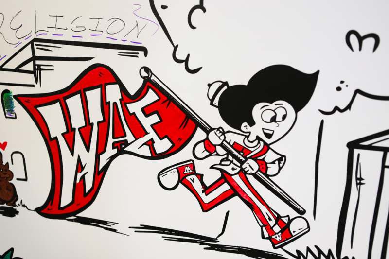a cartoon character holding a flag