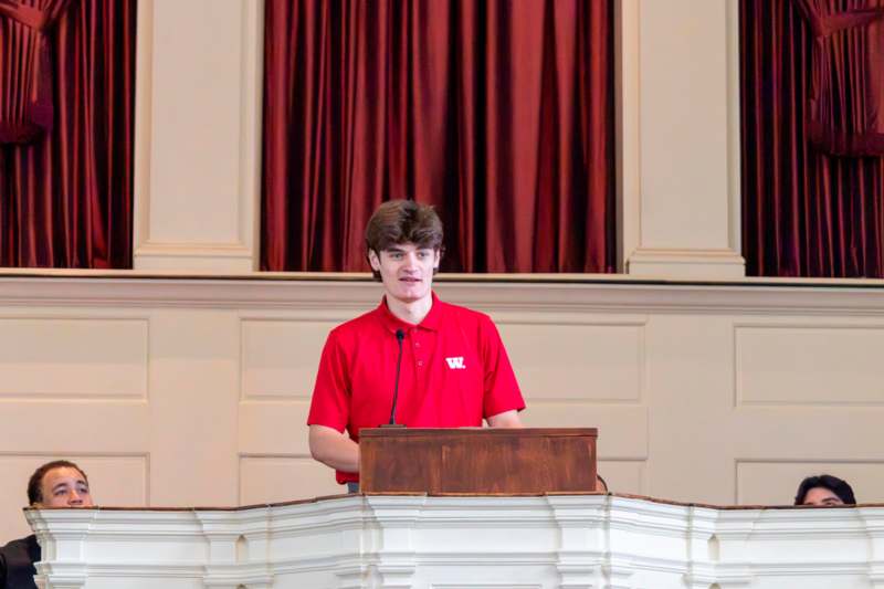 a man standing at a podium
