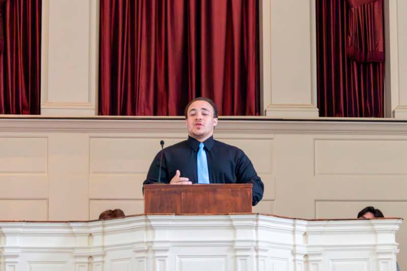a man standing at a podium