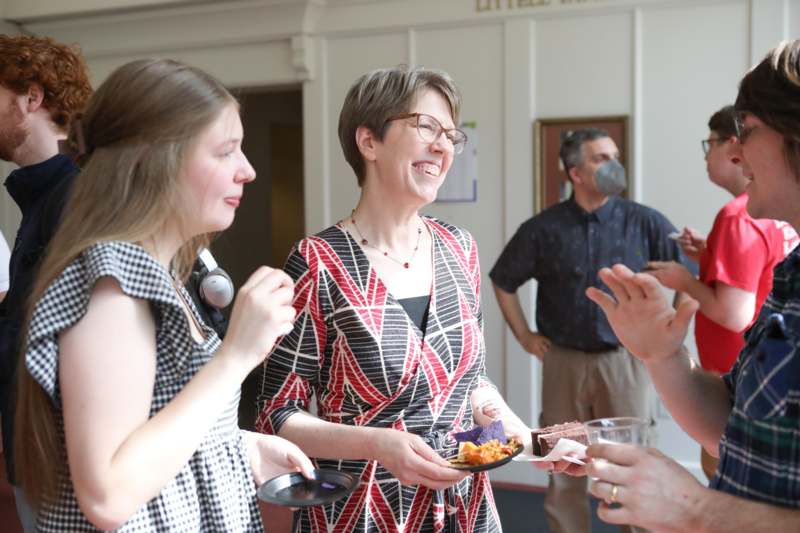 a group of people standing and smiling