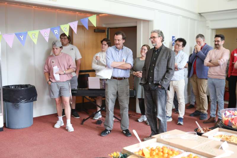 a group of people standing in a room