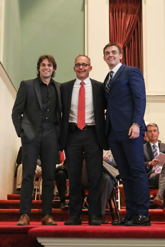 a group of men standing on stairs