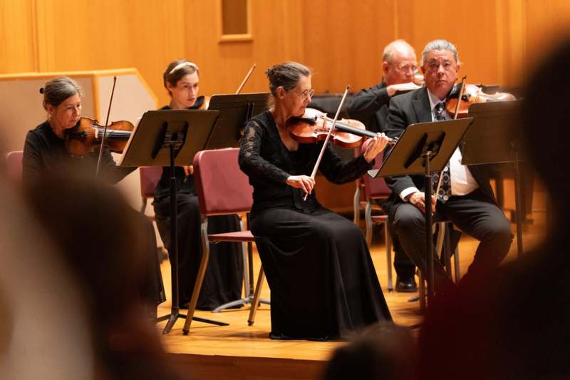 a group of people playing instruments