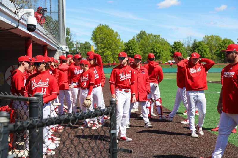 a group of baseball players in red uniforms