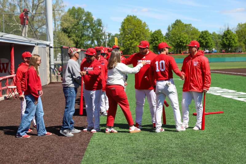 a group of people in red uniforms