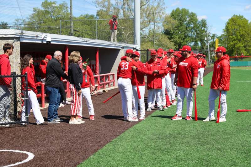 a group of people in red uniforms