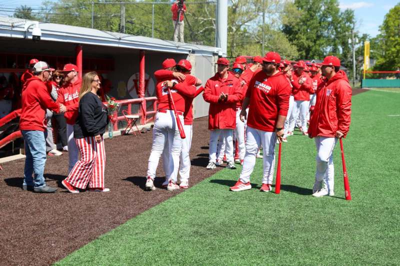 a group of people in red uniforms