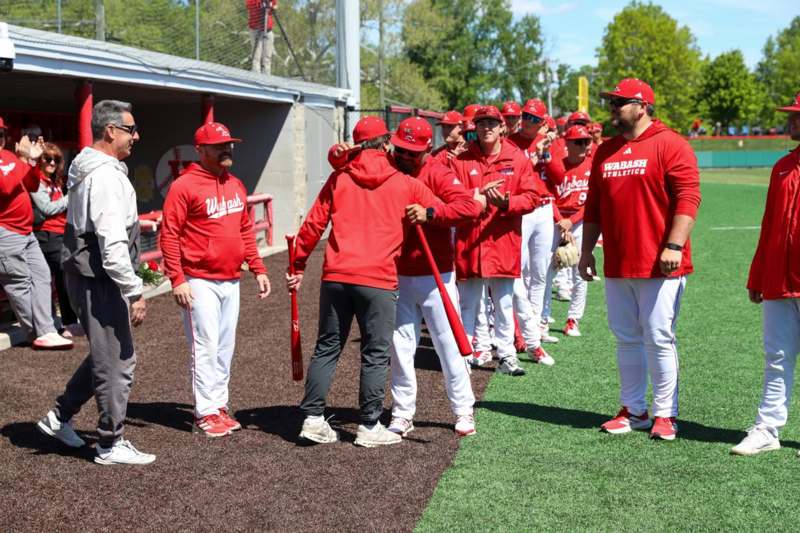 a group of men in red uniforms
