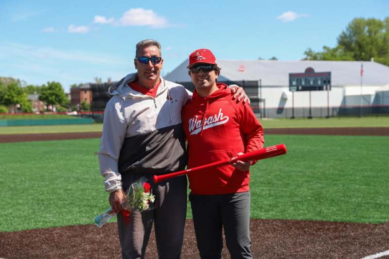 two men standing on a field