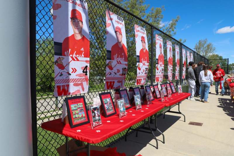Wabash Baseball Senior Day - a group of posters on a fence