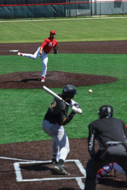 a baseball player throwing a ball