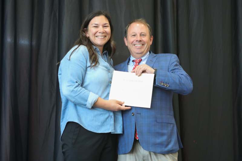 2026 Faculty and Staff Retirement and Recognition Luncheon - a man and woman holding a piece of paper