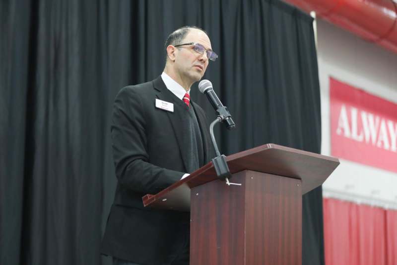 Senior Breakfast and Commencement Rehearsal - a man standing at a podium with a microphone