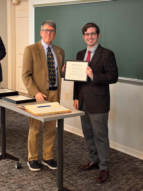 two men standing next to each other