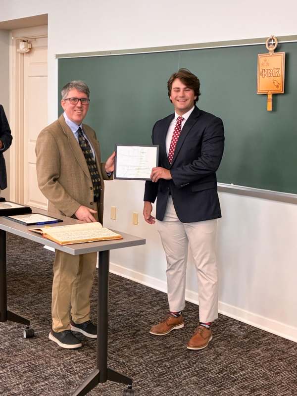a man holding a piece of paper