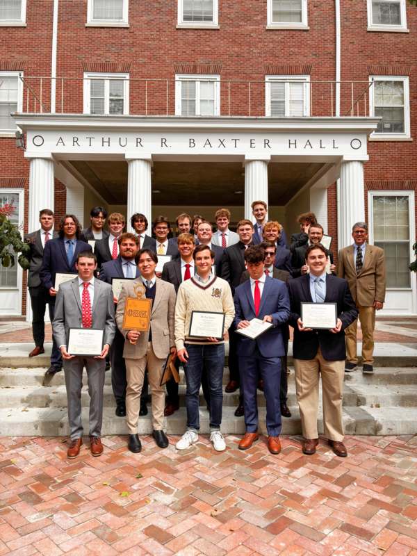 a group of people holding certificates