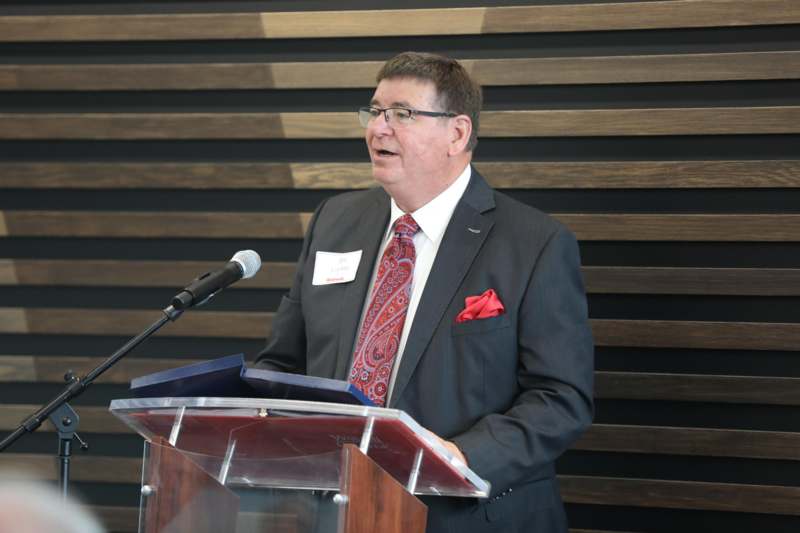 a man standing at a podium