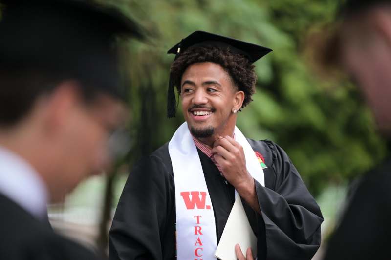 a man in a graduation gown