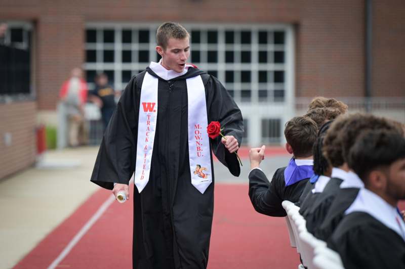 a man in a graduation gown