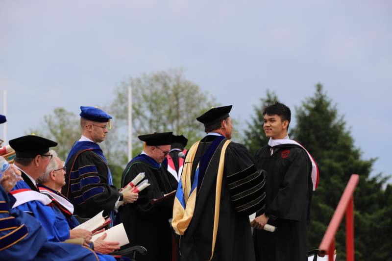 a group of people in graduation gowns