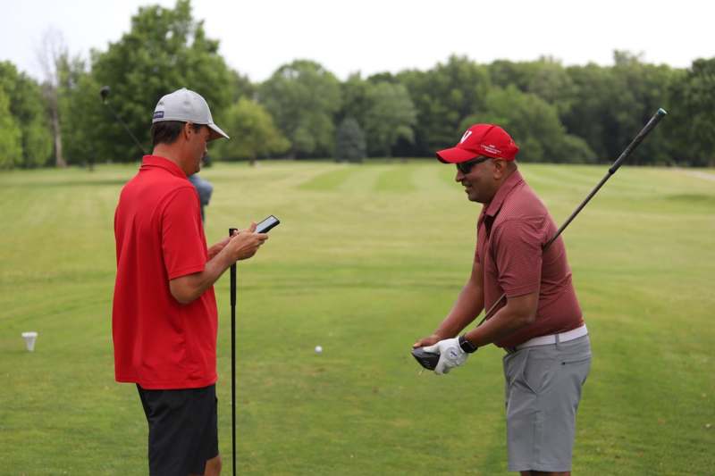 a group of men on a golf course