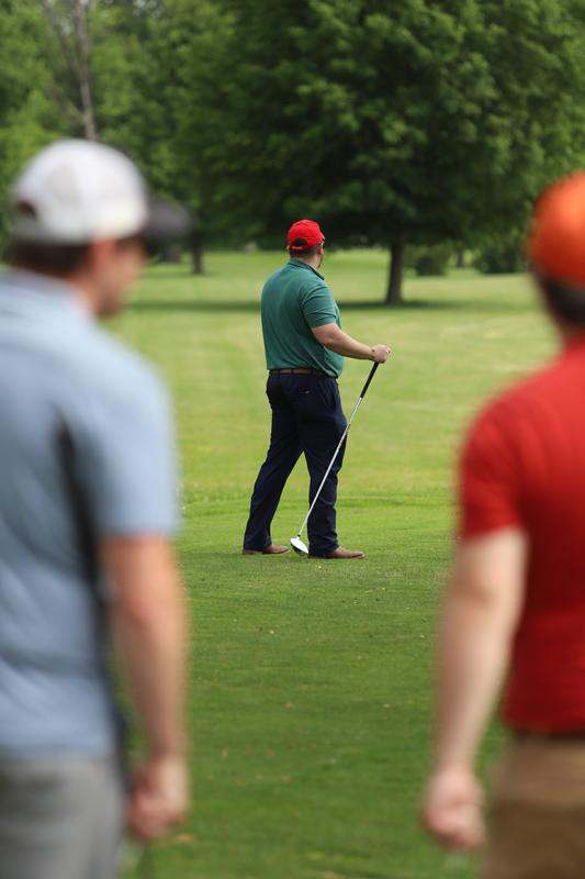 a man holding a golf club
