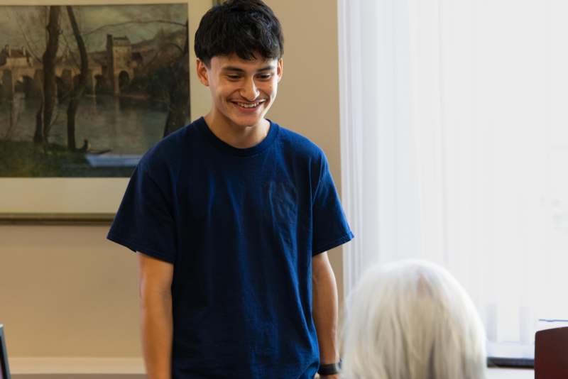 2026 WLAIP Listening Party - a man smiling at an old woman