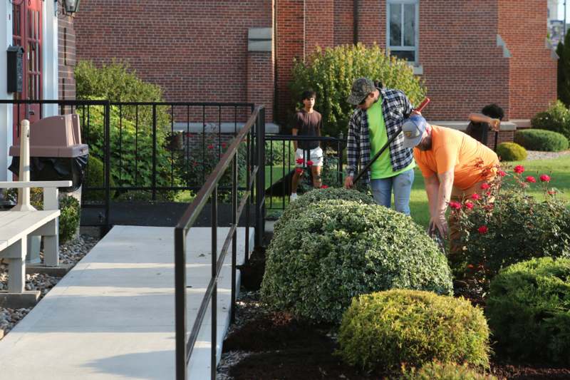 a group of people gardening