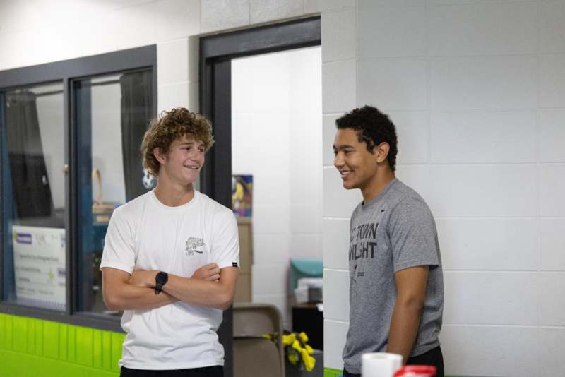 two men standing in a room