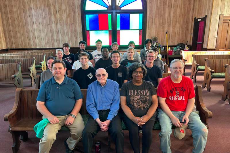 a group of people sitting in a church