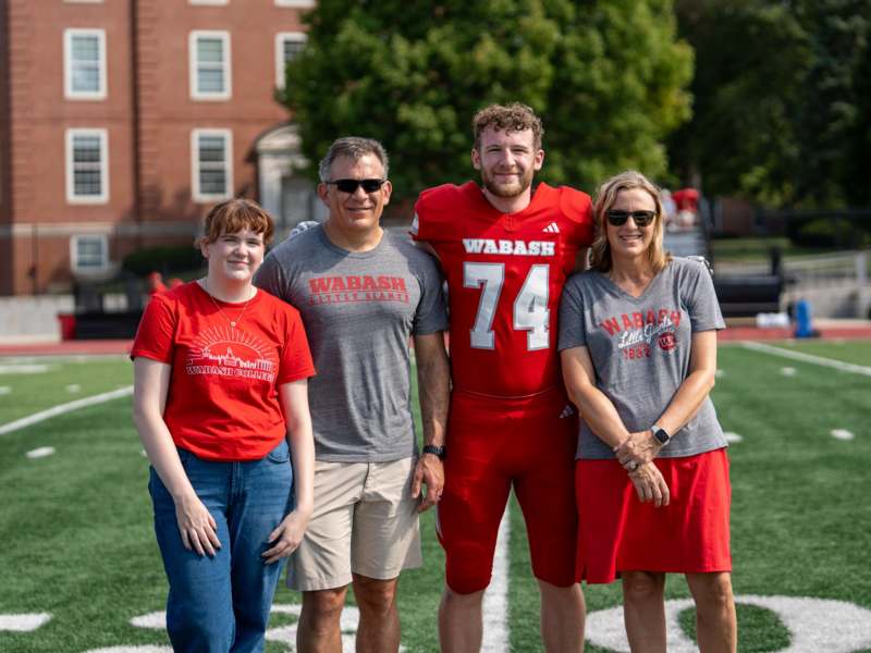 a group of people standing on a football field