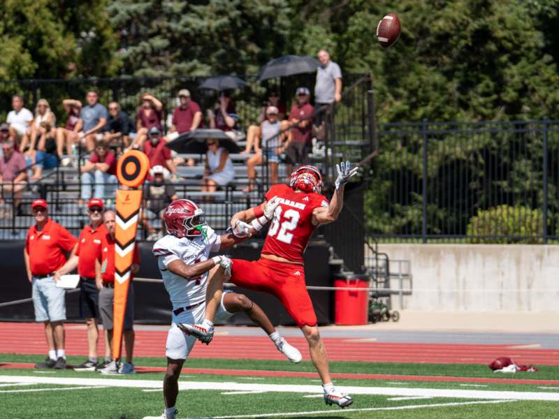 a football player catching a ball