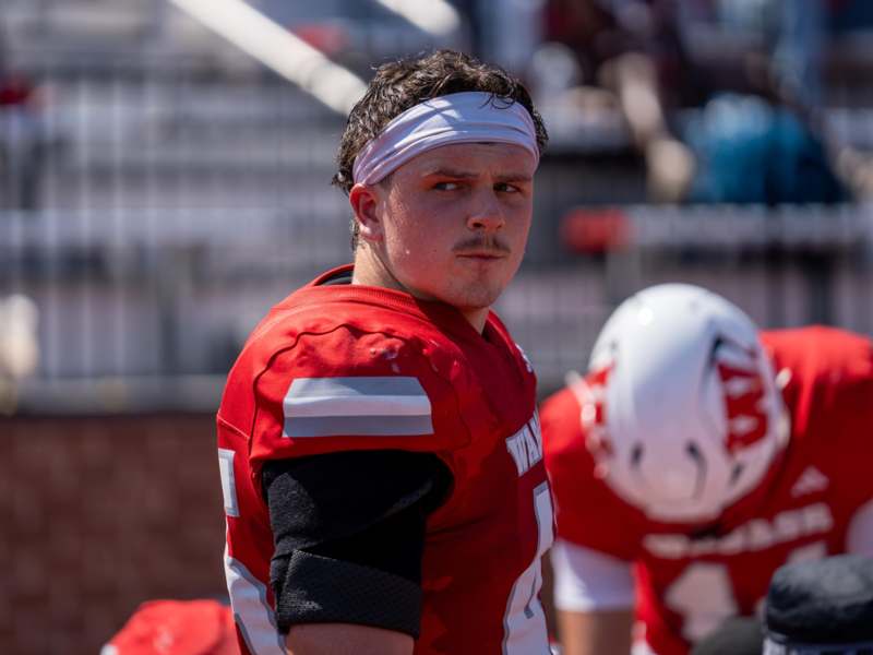 a man wearing a headband and jersey
