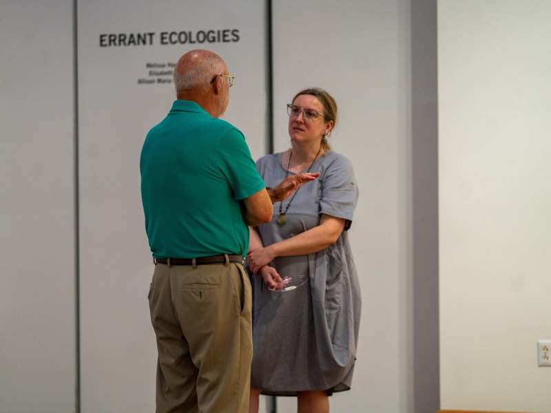 Art Show (09.08.26) - a man and woman standing in a room