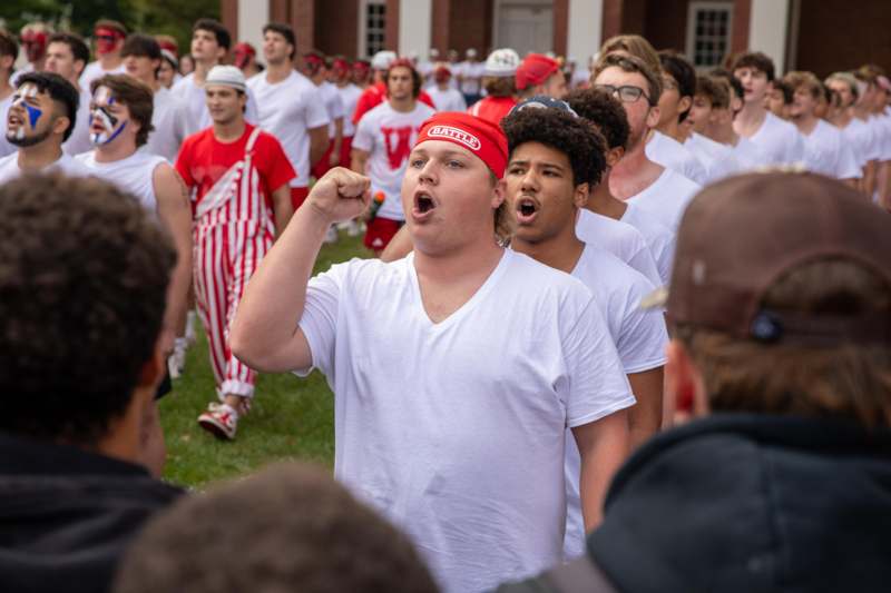a group of people in white shirts