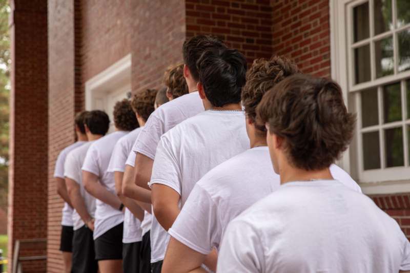 a group of people standing in a line