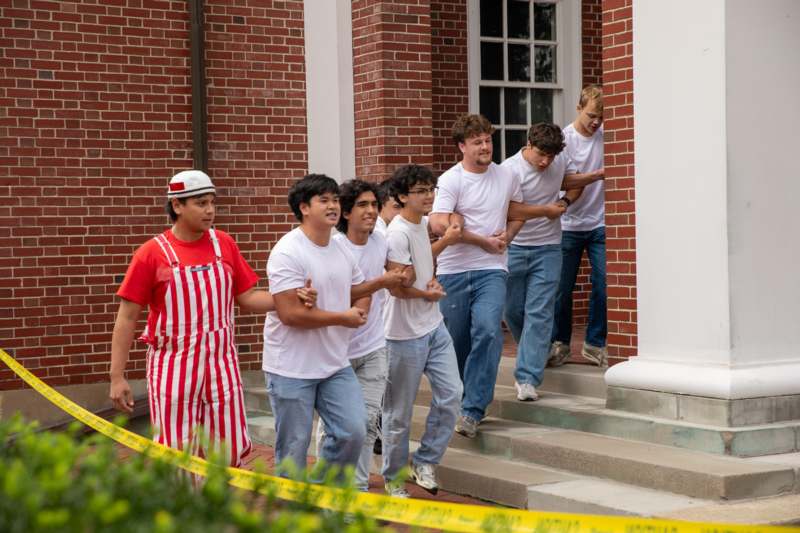 a group of men walking up stairs