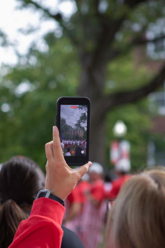 a person taking a picture of a group of people
