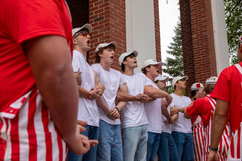 a group of people standing in a line