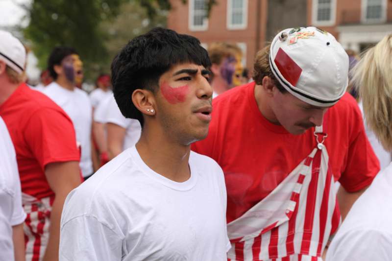 a man with red paint on his face
