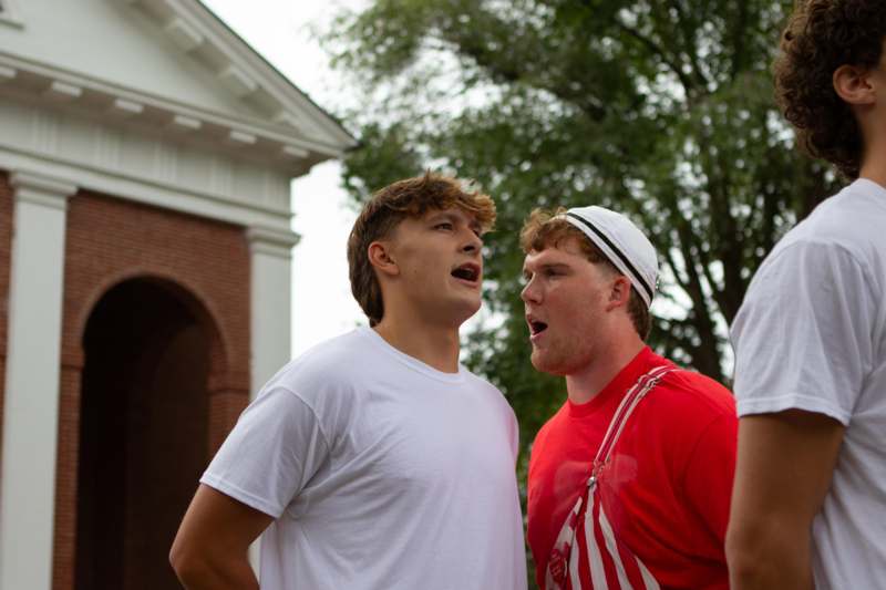 a group of men standing outside