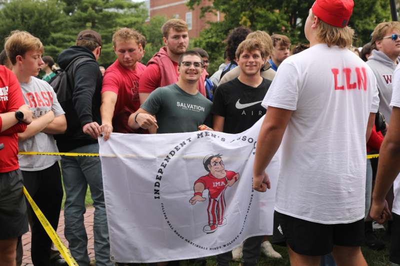a group of people holding a flag