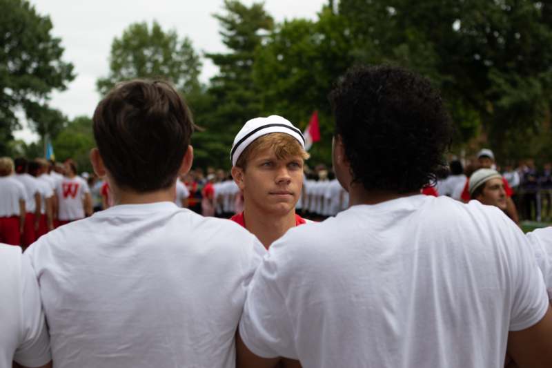 a group of men standing in a circle