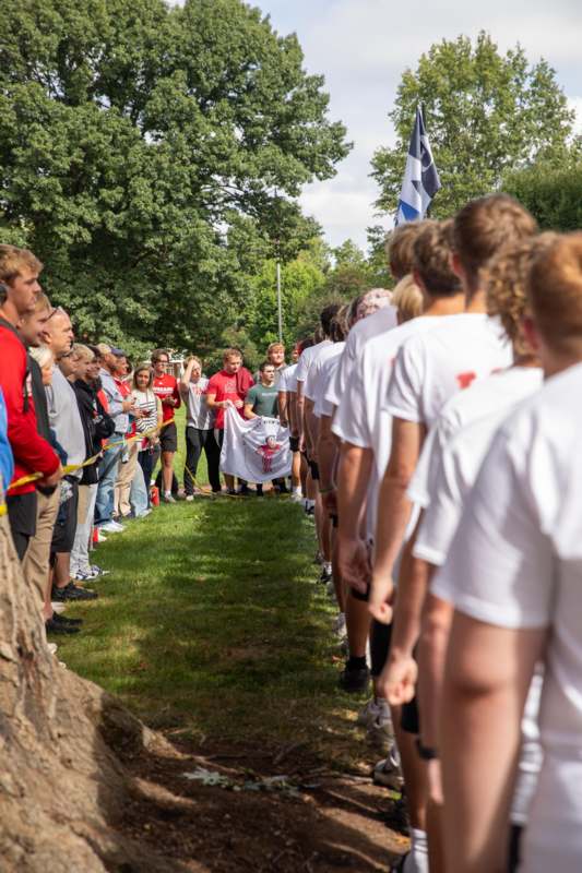 a group of people standing in a line