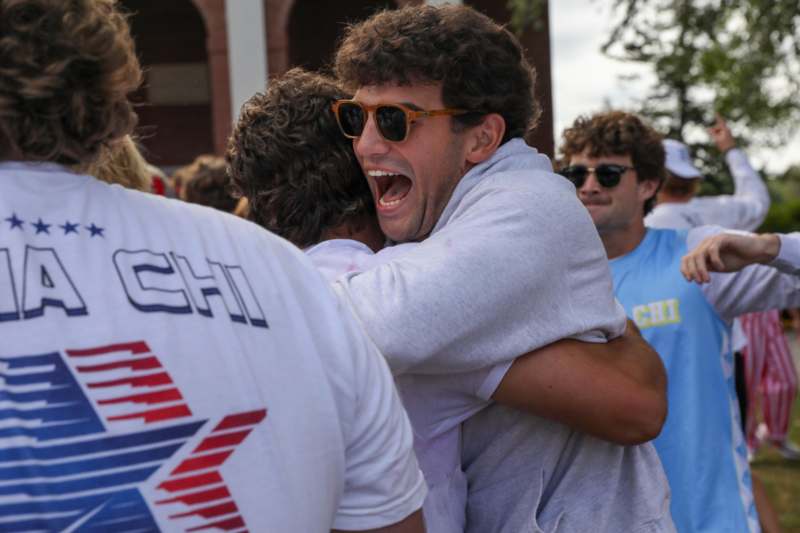a man hugging another man