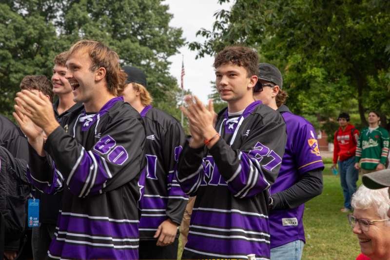 a group of men in sports uniforms